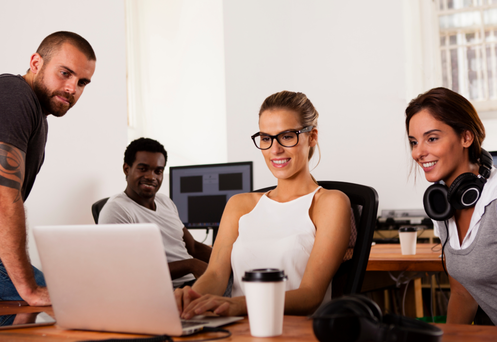 Team of HR professionals in Gloucestershire looking at laptop
