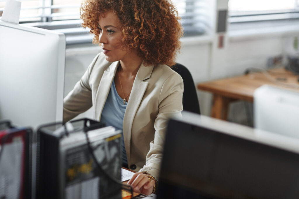 Gloucestershire women at desk utilising recruitment processing outsourcing